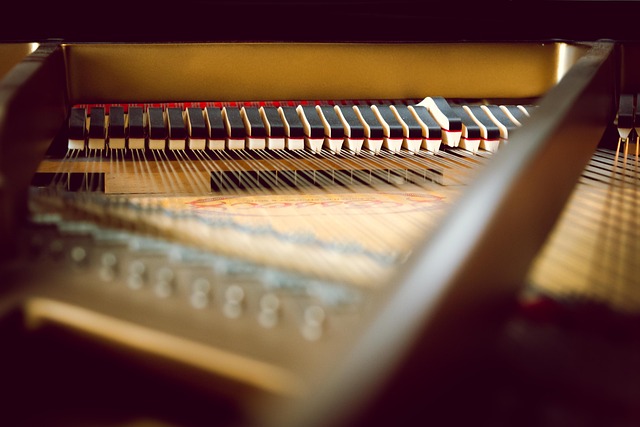 Close-up interior view of a grand piano's hammers and strings